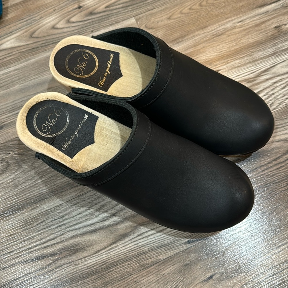 No 6 black slip-on clogs.